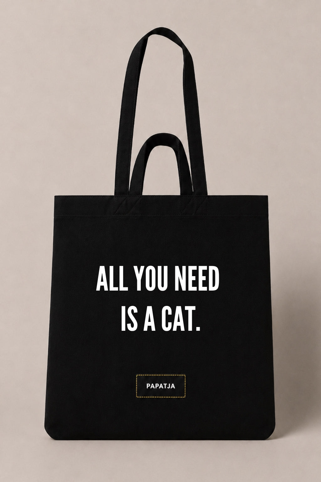 Black cotton PAPATJA tote bag with the quote All You Need Is a Cat, a lovely gift for cat lovers.