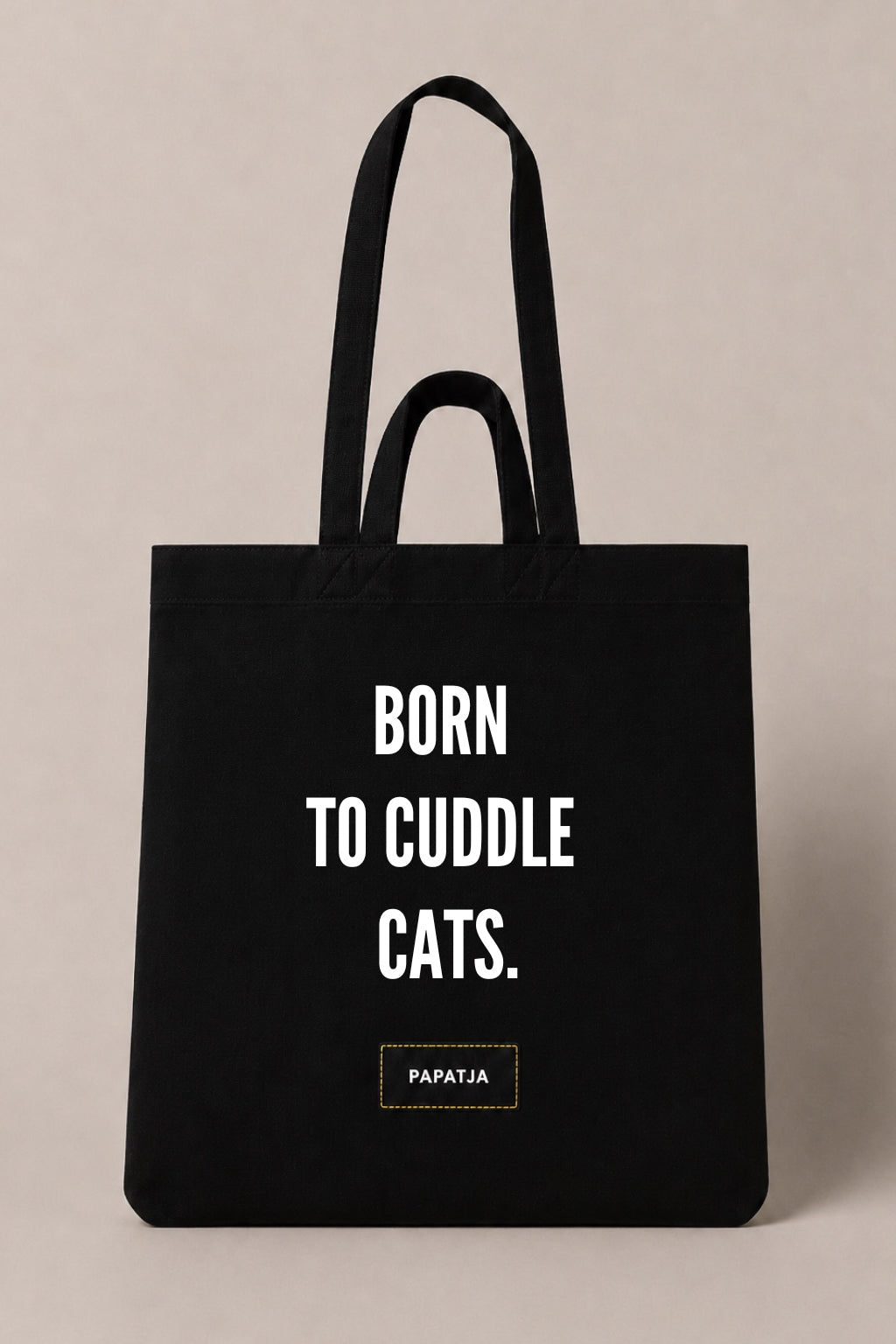 Black cotton PAPATJA tote bag with the quote Born to Cuddle Cats, a lovely gift for cat lovers who love cuddling their cat.