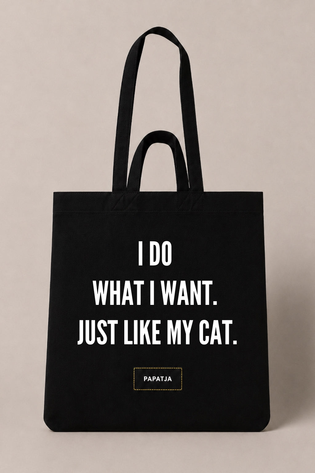 Black cotton PAPATJA tote bag with the quote I Do What I Want. Just Like My Cat, a funny gift for cat lovers.