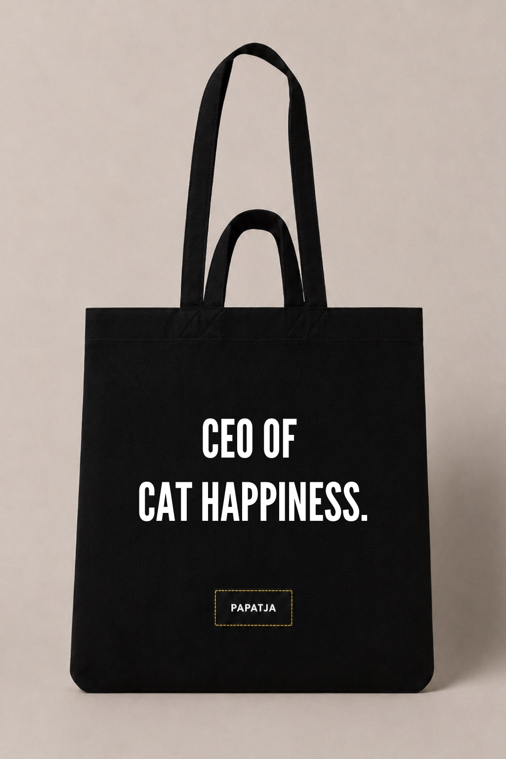 Black cotton PAPATJA tote bag with the quote CEO of Cat Happiness, a funny gift for cat lovers and cat moms.