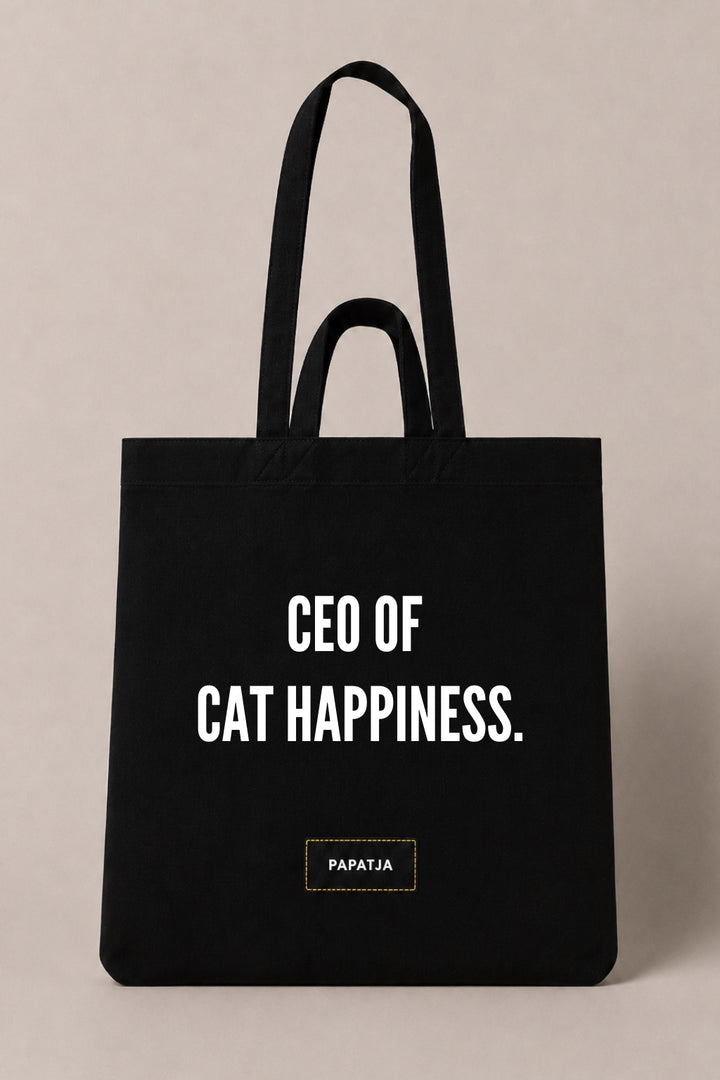 Black cotton PAPATJA tote bag with the quote CEO of Cat Happiness, a funny gift for cat lovers and cat moms.