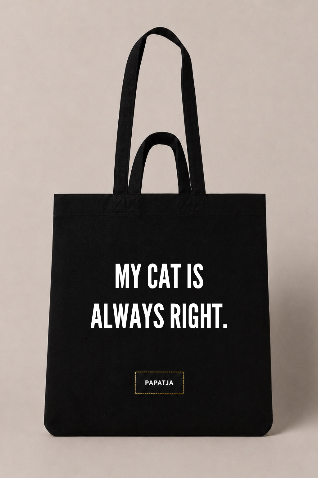 Black cotton PAPATJA tote bag with the quote My Cat Is Always Right, a funny gift for cat lovers.