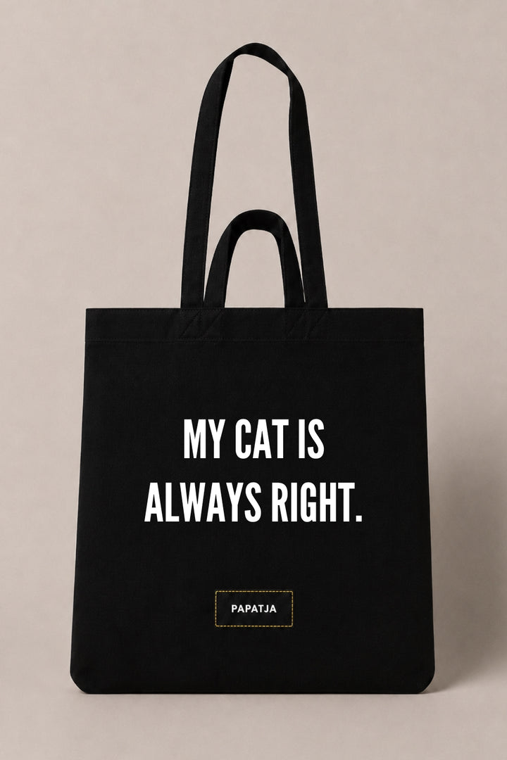 Black cotton PAPATJA tote bag with the quote My Cat Is Always Right, a funny gift for cat lovers.