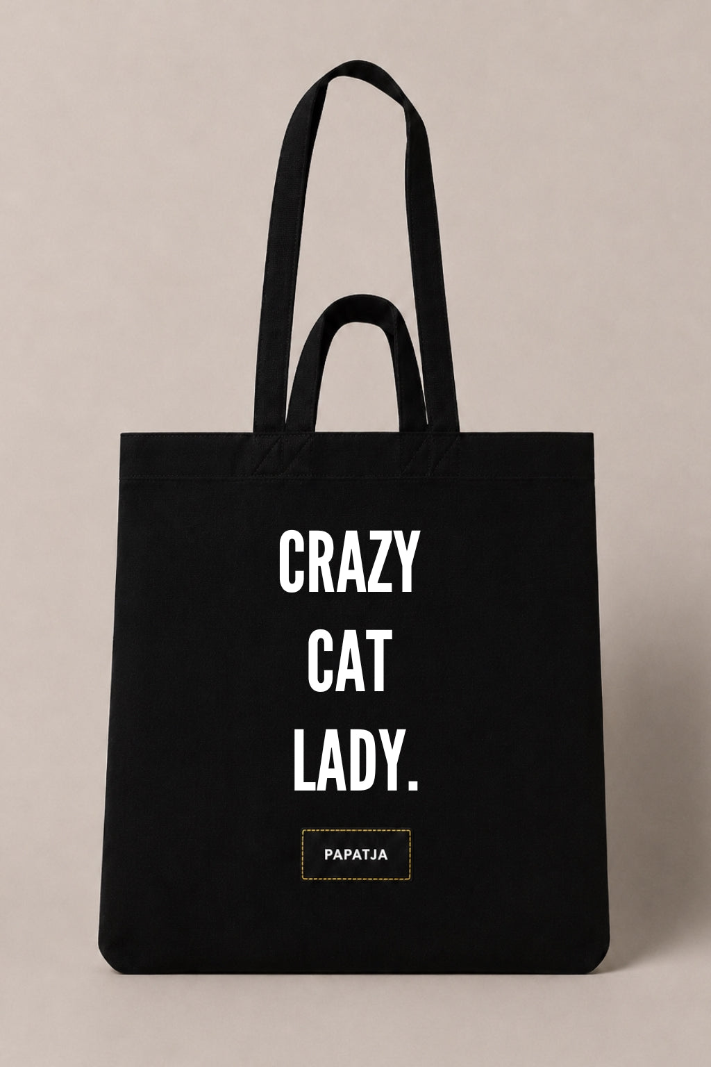 Black cotton PAPATJA tote bag with the quote Crazy Cat Lady, a funny gift for cat lovers with a sense of humor.